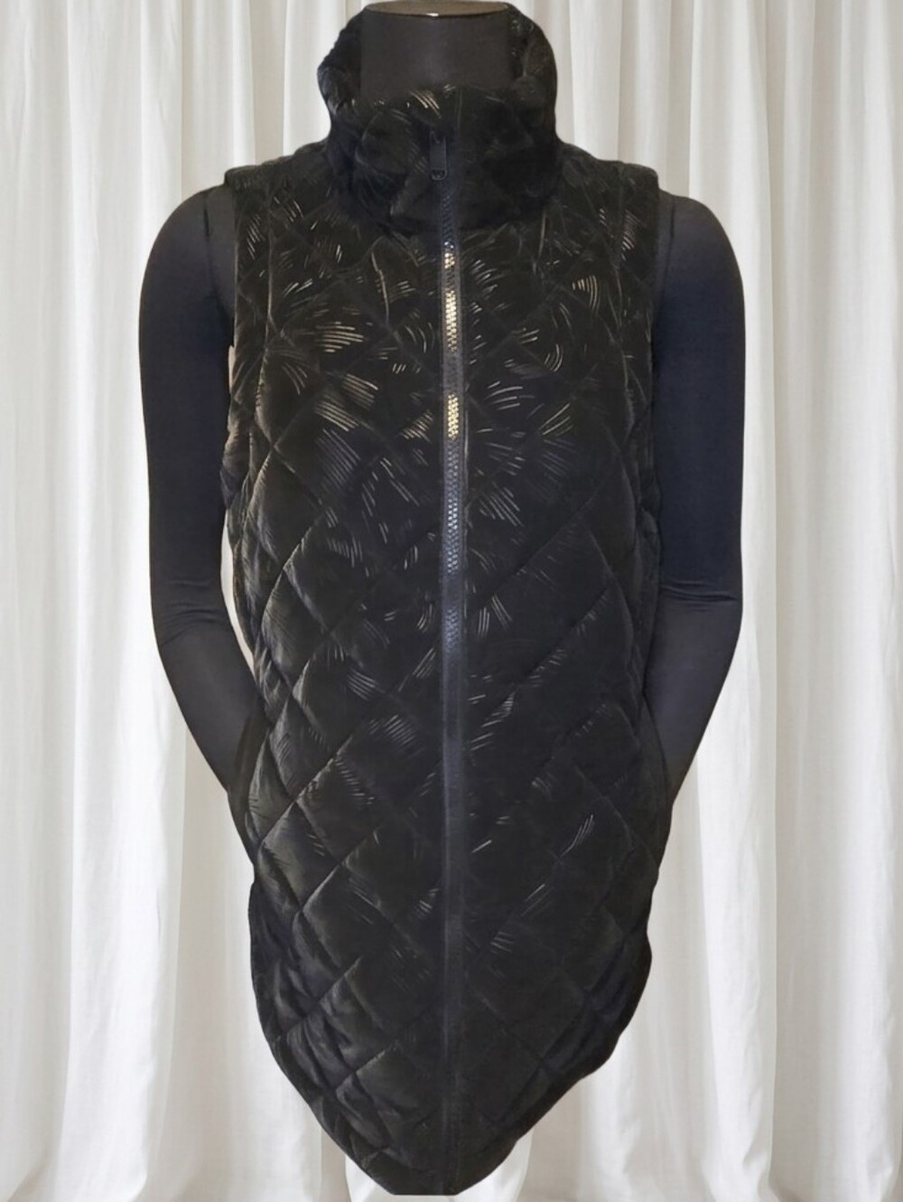 Athleta Whisper Featherless Luxe Velvet Vest in black with a quilted pattern.